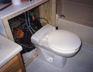 Toilet with Iseki Vacuum Valve installed in sump