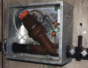 Interface valve mounted in wall cabinet.