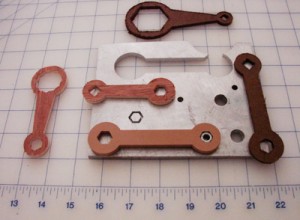 Shown above are several test parts cut from wood to test the g-code plus a piece of aluminum from which one of the wrenches was cut.